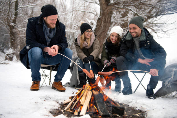 istock Friends having barbecue on a snowy day 1175019730