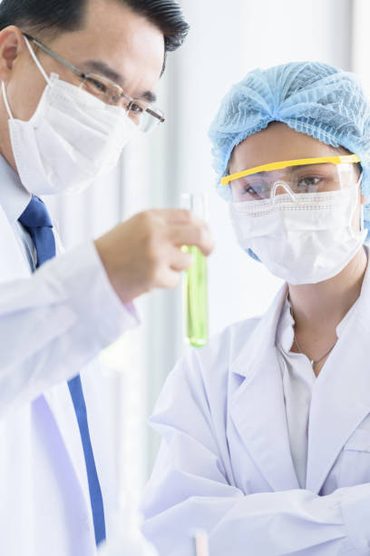 istock Asian young student scientist researching  and learning with senior scientist have teaching in a laboratory. 1175019883