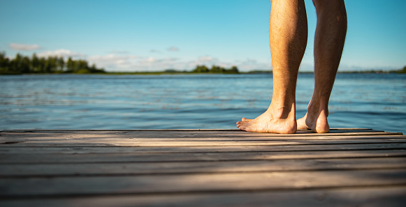 Barefoot on a wooden walkway in Finland | Panorama