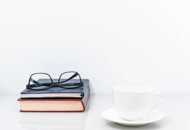 istock Coffee cup and old books 1175021746