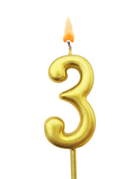 istock Golden birthday candle isolated, number 3 1175025363