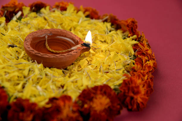 istock Diwali Diya with marigold flowers and gift boxes 1175025404