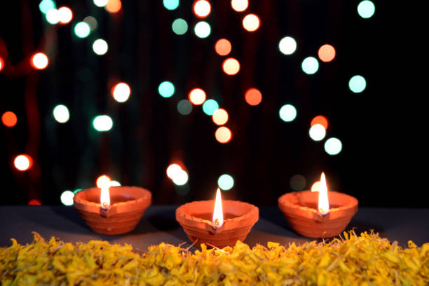 istock Diwali Diya with marigold flowers and gift boxes 1175025406