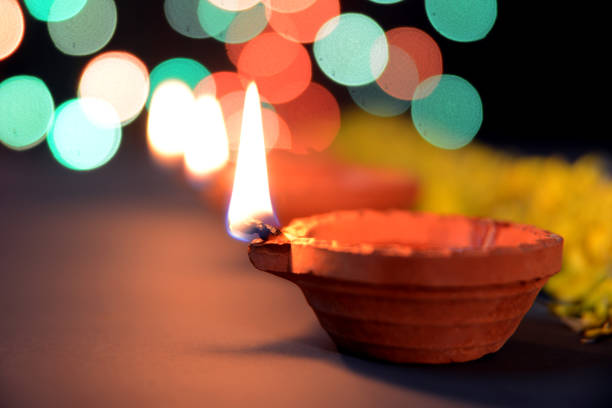 istock Diwali Diya with marigold flowers and gift boxes 1175025455
