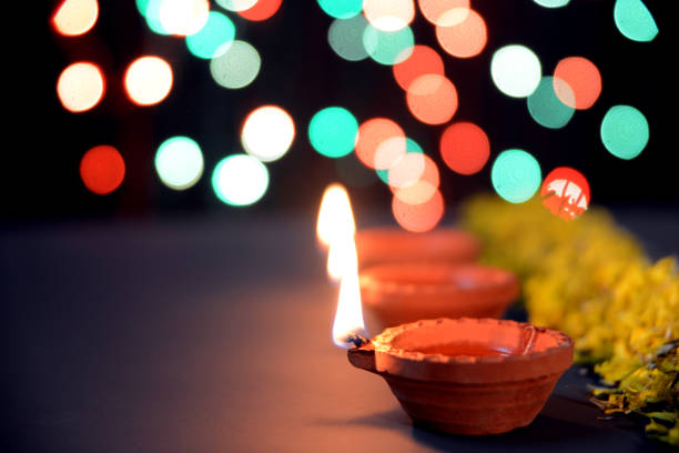 istock Diwali Diya with marigold flowers and gift boxes 1175025494