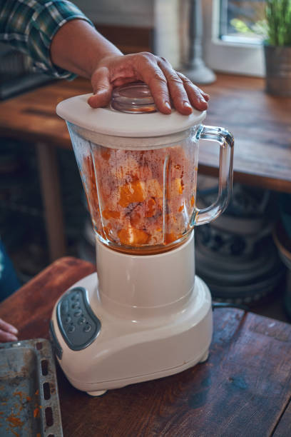 istock Preparing Pumpkin Soup with Blender in Domestic Kitchen 1175027258