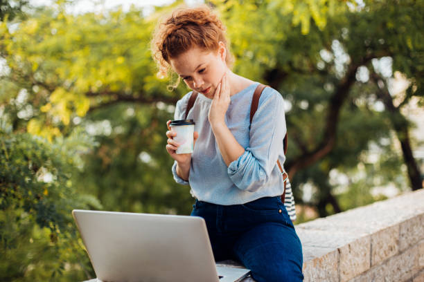 istock Girl having coffee and working freelance 1175028396