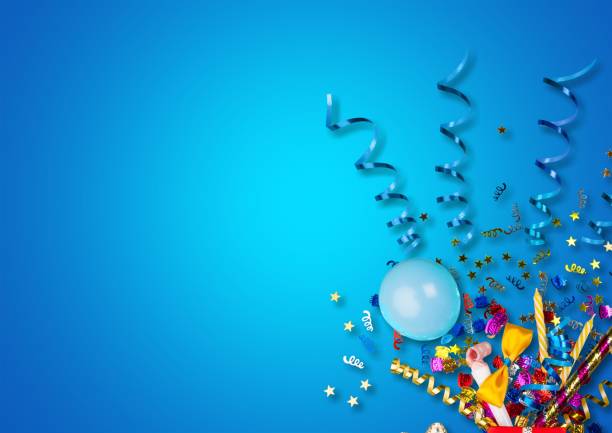 Background. Colorful balloons and confetti on blue table anniversary stock pictures, royalty-free photos & images