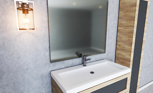 A modern and minimalist bathroom showing a sink and stylish mirror. There is a white heater at one side and through the mirror the shower can be seen.