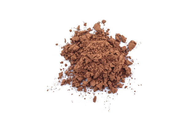 istock pile cocoa powder top view on white background. 1175030299