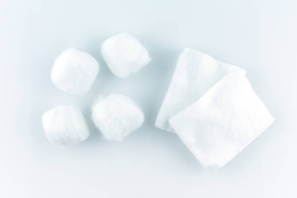 cotton ball and pad white soft clean beauty health medicine on white background. cotton ball and pad white soft clean beauty health medicine on white background. cotton cotton ball fiber white stock pictures, royalty-free photos & images