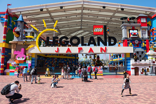 Nagoya, Japan - April 08, 2019: Unidentified visitors at Japan Legoland entrance in sunny day. Famous theme park landmark especially for children age around 1 to 7 years old.
