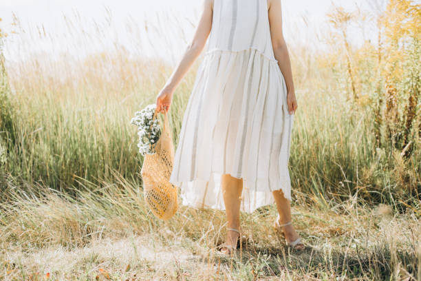 istock woman natural clothes eco mesh string bag wildflowers 1175033074