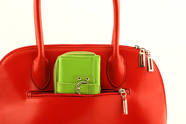 istock Green wallet in red handbag's pocket 117503498