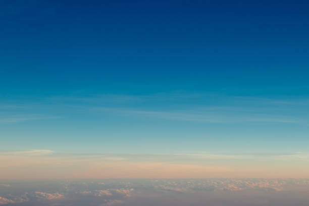 istock Aerial view sunset sky above clouds with dramatic light. View from airplane 1175035460
