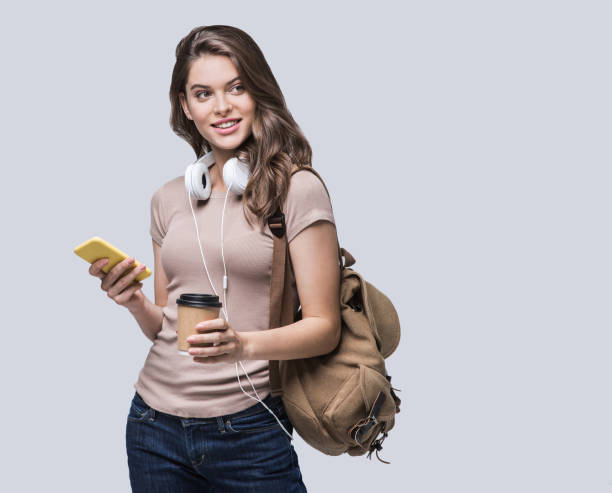 istock Happy young student girl using smart phone 1175035584