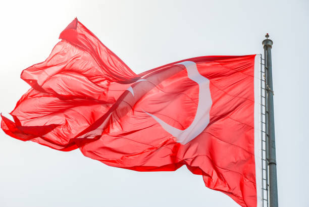 istock Turkish flag. Waving under the blue sky 1175035967