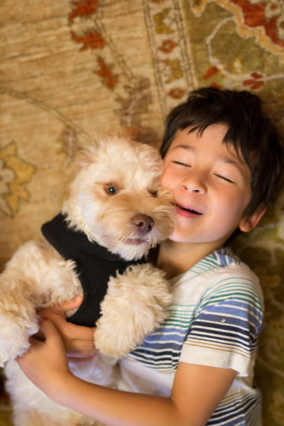istock Little boy with his puppy 1175036784