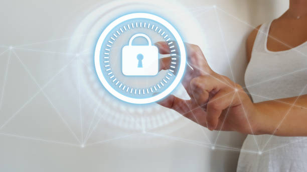 istock Businesswoman touching digital padlock security interface to protect datas 1175036904