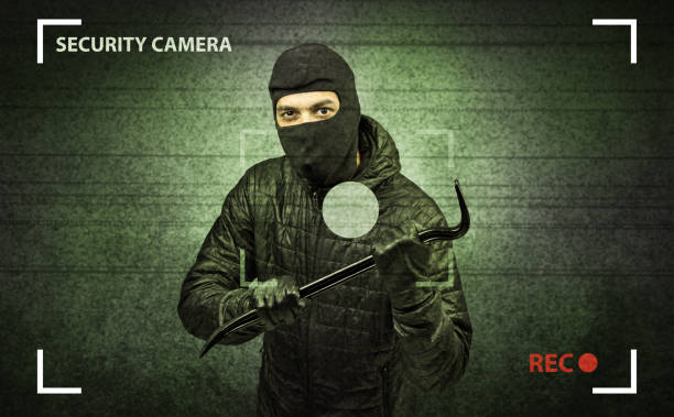 istock Burglar in action. 1175036978