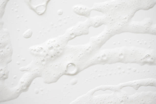 istock Abstract background white soapy foam texture. Shampoo foam with bubbles 1175039814
