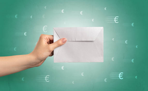 istock Hand holding envelope with symbols around 1175039878