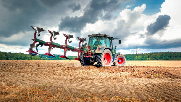 Tractor plows the field Tractor plows the field sowing photos stock pictures, royalty-free photos & images