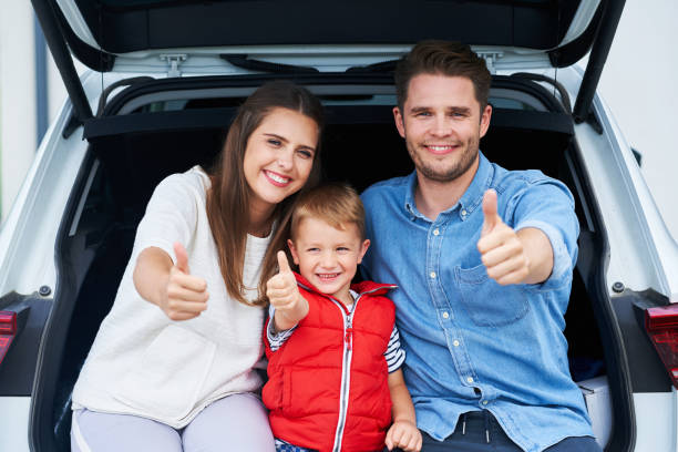 istock Happy family going for a trip by car 1175040110