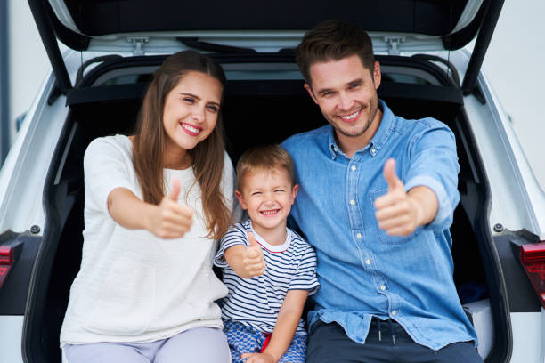 istock Happy family going for a trip by car 1175040113