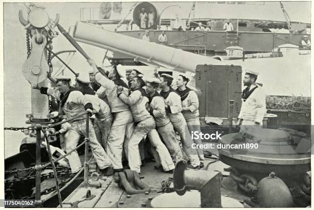 Crews Pulling Up Anchor On Hms Majestic Battleship Stock Photo - Download Image Now