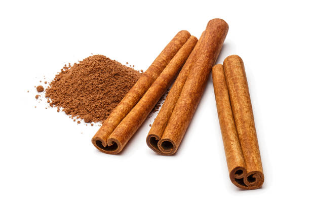istock Cinnamon sticks and powder on white 1175040693
