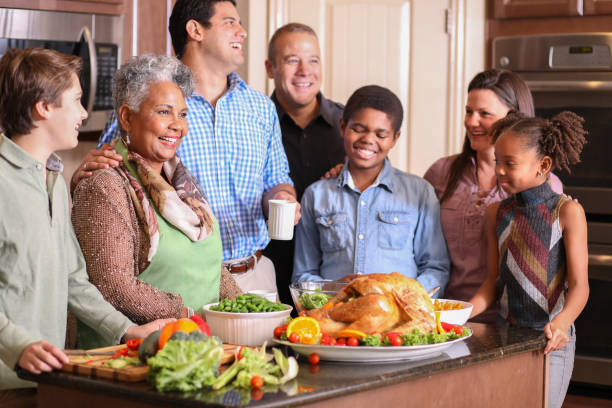 istock Diverse family in home kitchen cooking Thanksgiving dinner. 1175041264