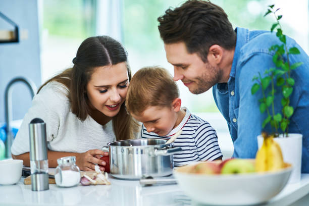 istock Young family spending time together in the kitchen 1175042843