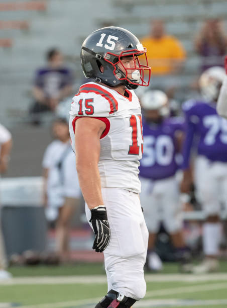 istock Young Boy Playing High School Tackle Football 1175043555