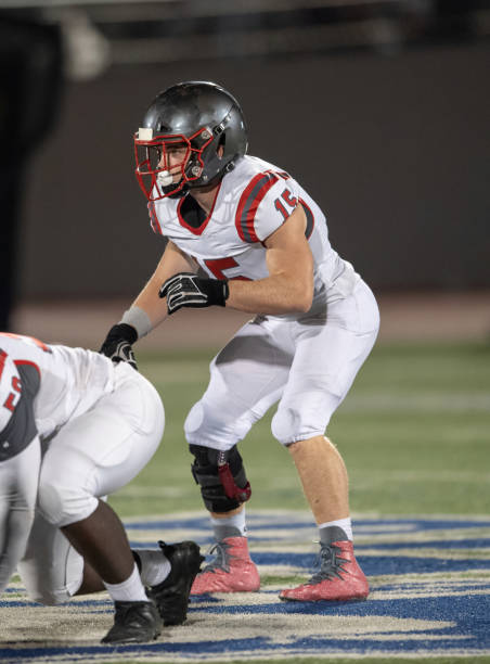 istock Young Boy Playing High School Tackle Football 1175043556