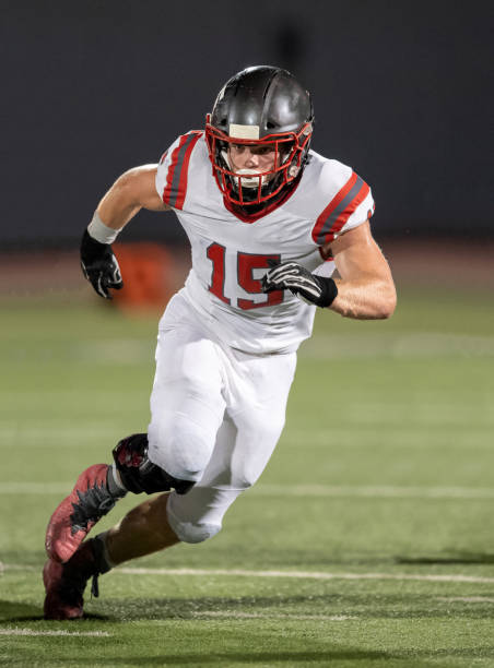 Young Boy Playing High School Tackle Football