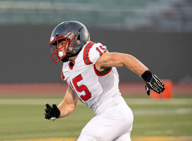 istock Young Boy Playing High School Tackle Football 1175043570