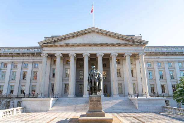 the treasury building during the national cherry blossom festival, washington dc, usa - us treasury department imagens e fotografias de stock