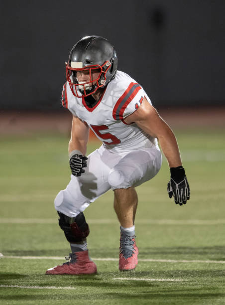 istock Young Boy Playing High School Tackle Football 1175043603