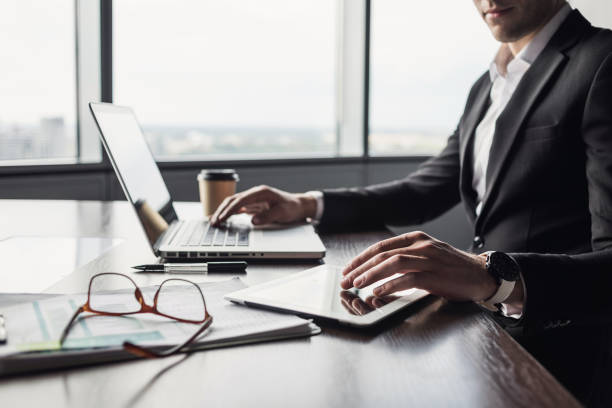 istock Businessman working on laptop computer in office 1175043611