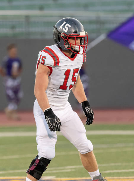 istock Young Boy Playing High School Tackle Football 1175043637
