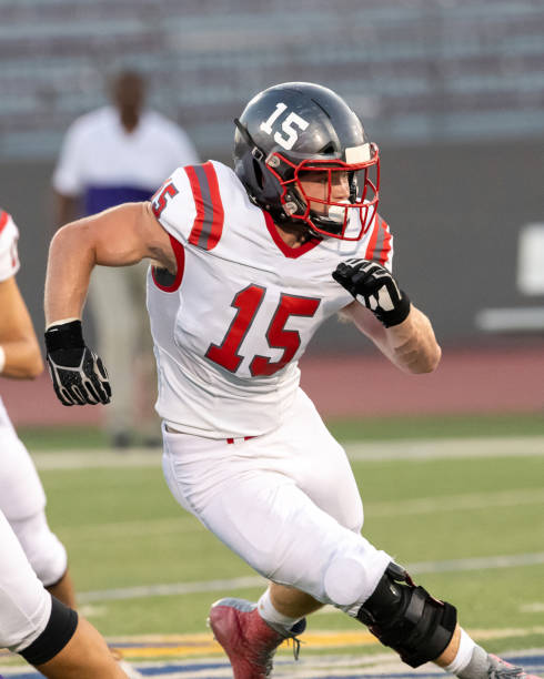 istock Young Boy Playing High School Tackle Football 1175043642