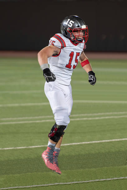 istock Young Boy Playing High School Tackle Football 1175043685