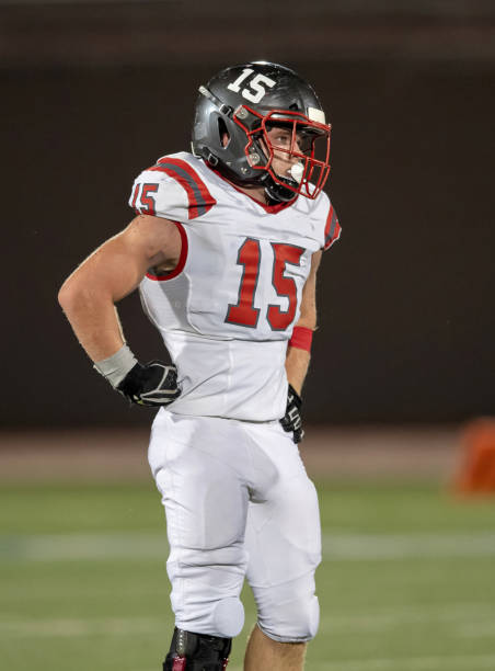 istock Young Boy Playing High School Tackle Football 1175043692