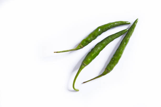 istock Three green chili pepper isolated on a white background. 1175044444