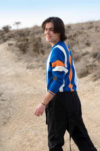 istock YOUNG MAN WITH STRIPED JERSEY 1175044582