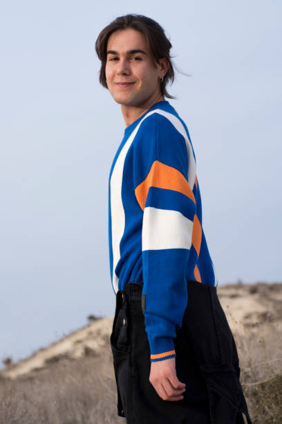 istock YOUNG MAN WITH STRIPED JERSEY 1175044609