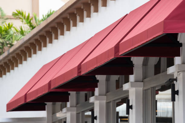 red awning over window of shop.