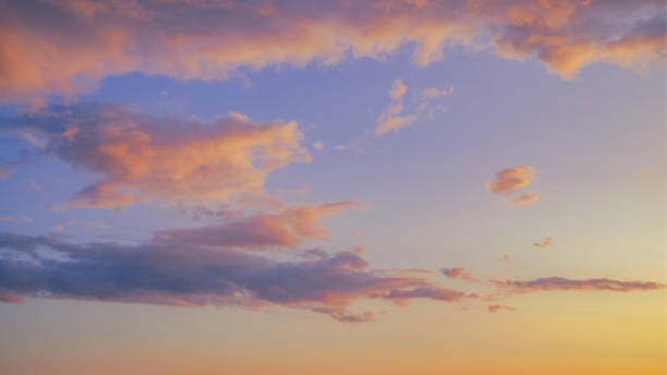 istock Beautiful twilight sunset sky and cloud at summer background image. New heaven light and earth concept. Dramatic sun ray with blue orange sky and pink purple clouds dawn texture color background. 1175044926