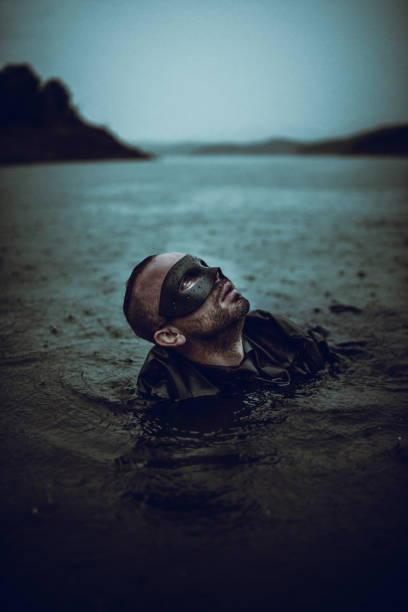 istock Businessman Climbing Out Of Depression 1175044939
